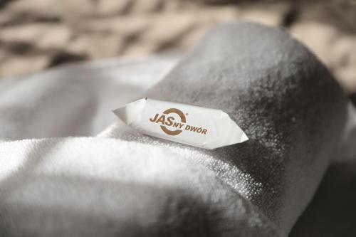 a piece of paper sitting on top of a napkin at Jasny Dwór in Polanica-Zdrój