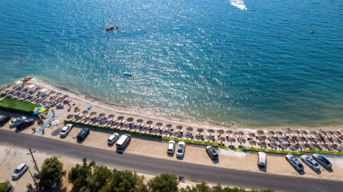 an aerial view of a beach with parked cars at Edva Resort in Vlorë