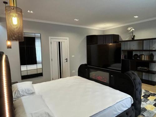 Postel nebo postele na pokoji v ubytování Ursachi Apartaments & Rooms