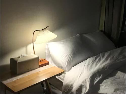 Cama o camas de una habitación en City view Residence 30 seconds to subway, APM, DDP, Dongdaemun, Dongmyo, Seoul Station, night market, vintage house