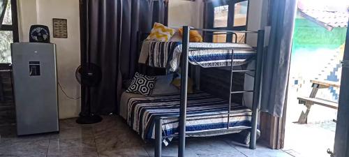 Ένα ή περισσότερα κρεβάτια σε δωμάτιο στο Casa Mazunteña