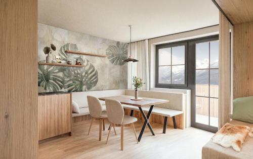 une salle à manger avec une table et des chaises dans une pièce dans l'établissement Carpe Solem Kaprun Apartments 4 stars by ALPS RESORTS, à Kaprun