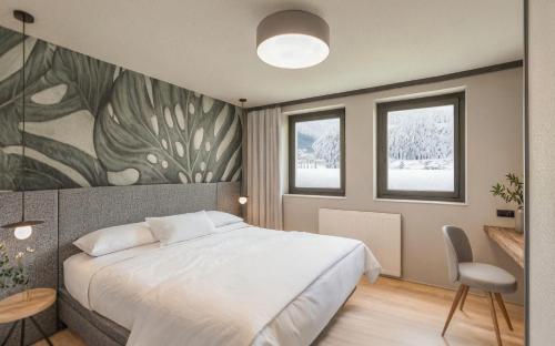 une chambre avec un grand lit et un tableau au mur dans l'établissement Carpe Solem Kaprun Apartments 4 stars by ALPS RESORTS, à Kaprun