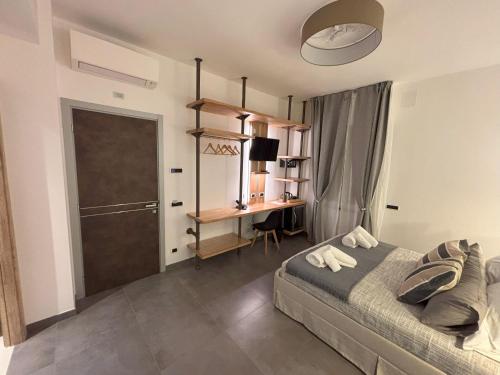 a bedroom with a bed and a desk in it at Metropolitan in La Spezia