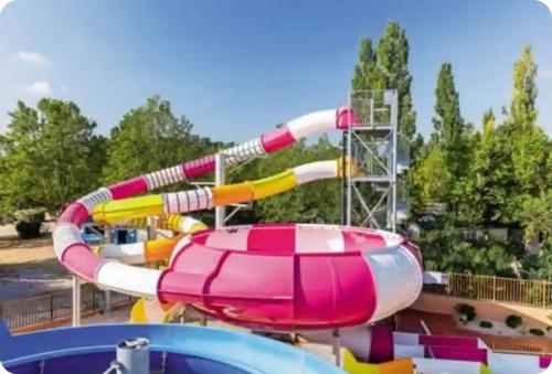 a water slide at a water park at Mobil home en Provence - Camping 4 étoiles- 2 chambres -4 à 6 pers-clim-terrasse-TV in Cadenet