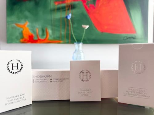 a group of three boxes with a vase on a table at Eclectic 6 in Satu Mare