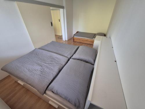 a small bedroom with a bed in a room at Apartmán U Babči in Telč