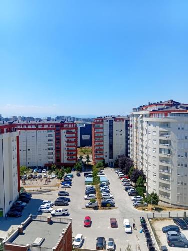 an aerial view of a parking lot in a city at Comfort hillside in Pristina