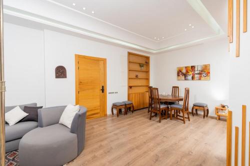 a living room with a couch and a table at Hassan Center 3BR Cozy Stay in Rabat