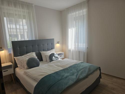 Postel nebo postele na pokoji v ubytování Nature Spring Deluxe Apartmants Zalakaros