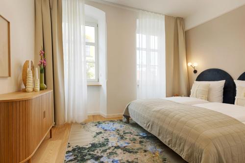 a bedroom with a bed and a window at homie stay Dominikus in Würzburg