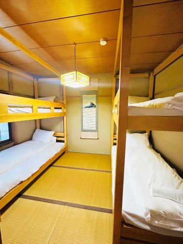 a room with two bunk beds in a boat at The Echoland in Hakuba
