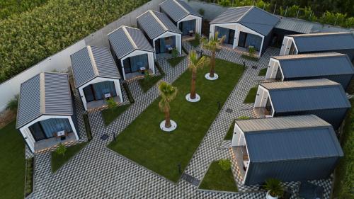 an overhead view of a row of modular homes with palm trees at Villas Palma Airport in Rinas