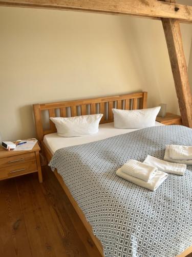 a bedroom with two beds with white pillows on them at Pension Bäumi-Hof in Seehausen