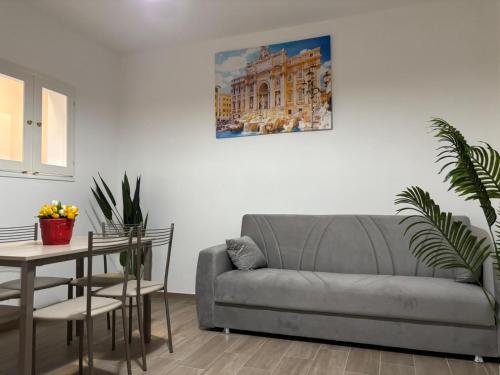 a living room with a couch and a table at Central Suite - Narramondo Villas in Giulianova