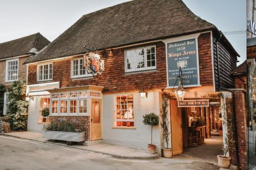 a building with a sign on the front of it at The Kings Arms Rooms in Canterbury