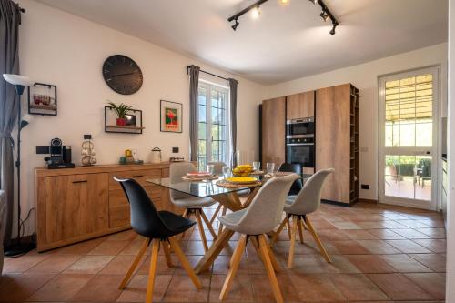 a kitchen with a dining room table and chairs at Ollie`s house in Leivi