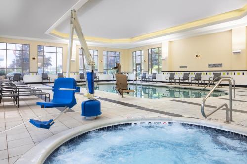 a large pool with a hot tub in a hotel room at Fairfield Inn & Suites – Buffalo Airport in Cheektowaga