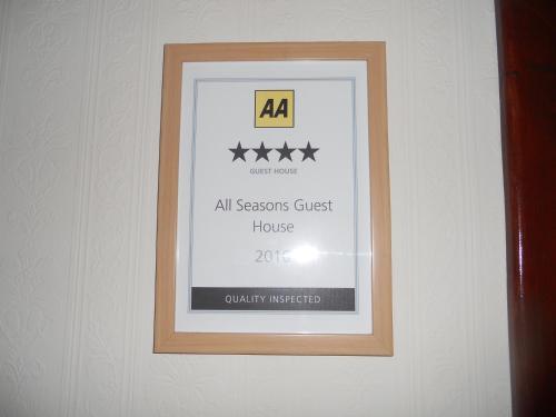a framed picture of a all seasons guest house at All Seasons Guest House in Great Yarmouth