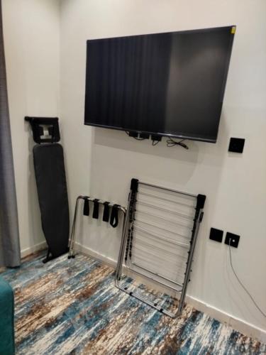 TV o dispositivi per l'intrattenimento presso روز سيتي للشقق المخدومة