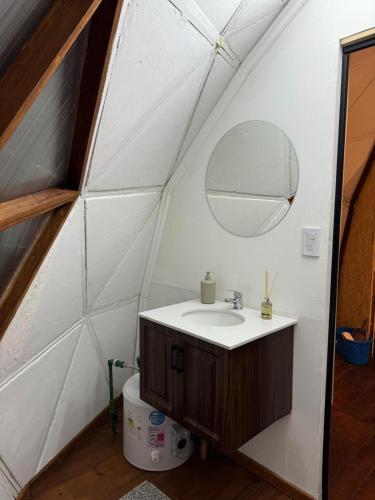 a bathroom with a sink and a mirror at Glamping il Tramonto in Villa Amancay