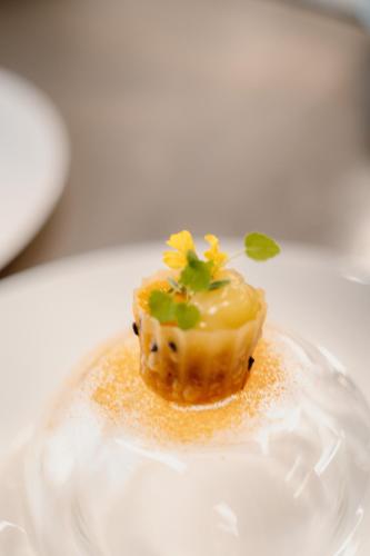 a small dessert on a plate on a table at Swiss Diamond Boutique Hotel - La Romantica in Melide