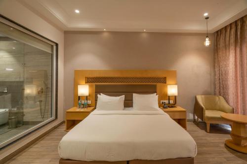 Un ou plusieurs lits dans un hébergement de l'établissement Excel Hotels & Resorts, Corbett