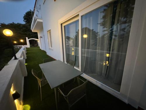 a table and chairs on the balcony of a building at Bella Ischia in Ischia
