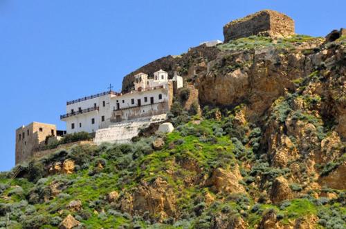 a building on the side of a mountain at Mary's House 2 in Skiros