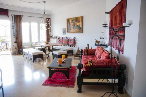 a living room with a couch and a table at Dar Ullaya in Hammamet