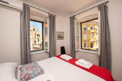 Postel nebo postele na pokoji v ubytování Split Ann Apartments