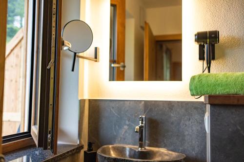 a bathroom with a sink and a mirror at Lacklehen in Ramsau
