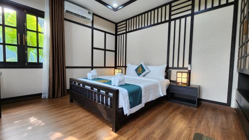 Postel nebo postele na pokoji v ubytování Đất Rồng Đinh Gia Trang