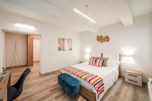 Voodi või voodid majutusasutuse Maison La Pomposa Suite toas