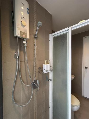a shower in a bathroom with a toilet and a shower at Skyline View 1 Bedroom Near RCA, Thonglor And Nana in Bangkok