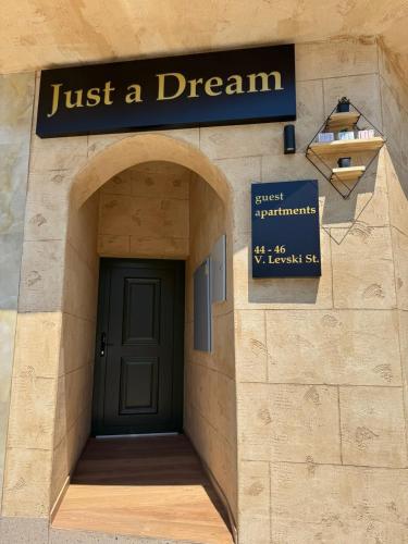a building with a sign that reads just a dream at Just a Dream - guest apartments in Troyan