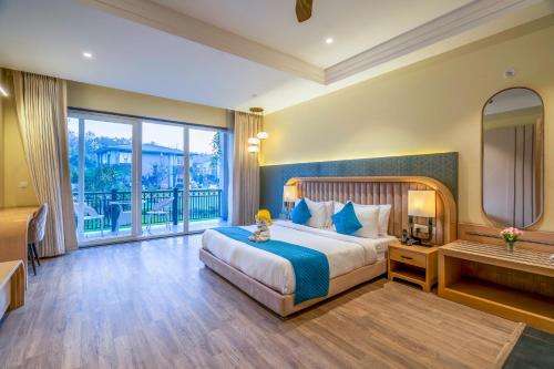 Un ou plusieurs lits dans un hébergement de l'établissement Excel Hotels & Resorts, Corbett