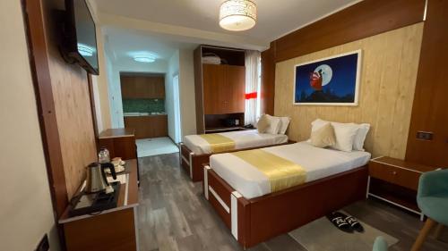 Postel nebo postele na pokoji v ubytování Abaት Guest House