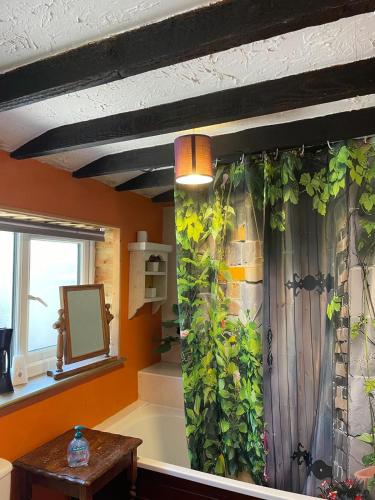a room with a wall with plants on it at Yarm Cottages in Yarm