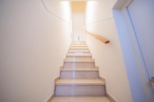 a staircase in a building with a stair case at Room Nabigi' - Centro Storico in Conversano
