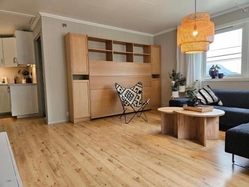 a living room with a couch and a table at Nesvika nature reserve Apartment only 20 min away from Bergen in Bergen