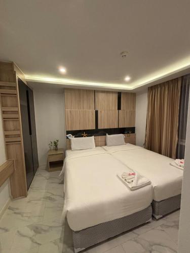 Ένα ή περισσότερα κρεβάτια σε δωμάτιο στο D Evolve Pattaya
