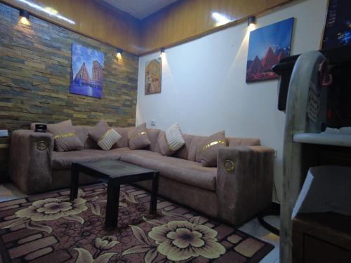 a living room with a couch and a table at Gardenia Hotel in Cairo