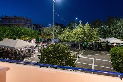 a parking lot with a tennis court at night at Casa Vacanza in Zakharo