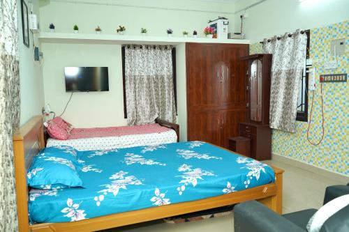 Ένα ή περισσότερα κρεβάτια σε δωμάτιο στο Jupiter Home stay