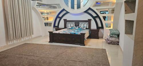 a bedroom with a bed in a room at Villa 91 in Salalah