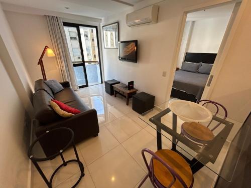 Televisyen dan/atau pusat hiburan di Charme e Conforto em Copacabana