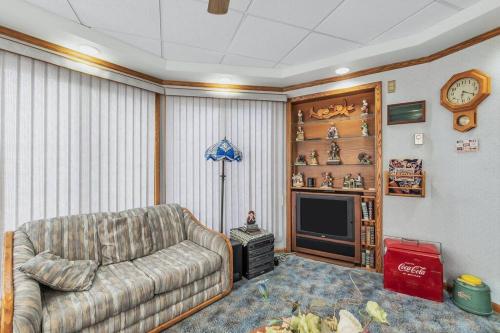 a living room with a couch and a tv at Clarks Summit Gem w/ Private Yard & Parking in Newton Center
