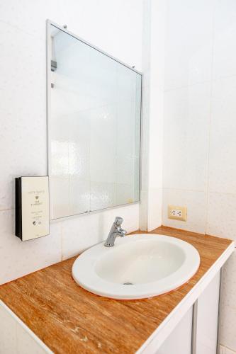 a bathroom counter with a sink and a mirror at Costa Beach in Zorritos