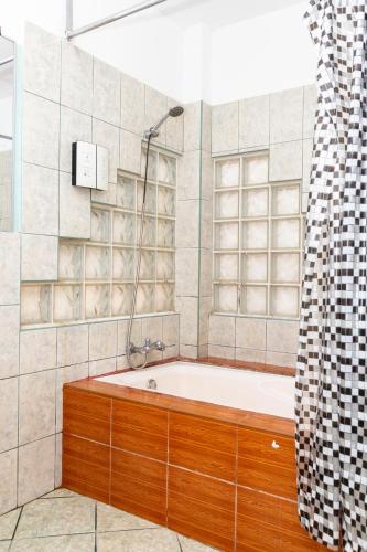 a bathroom with a bath tub and a shower at Costa Beach in Zorritos